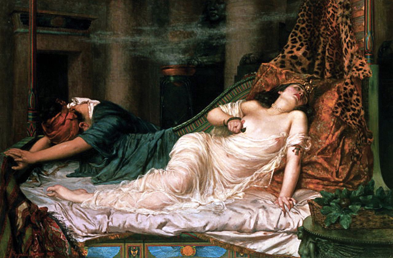 Cleopatra poisons herself in a suicide pact with Antony and her hand maidens